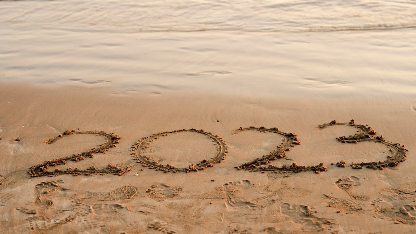 2023 written in the sand on the beach